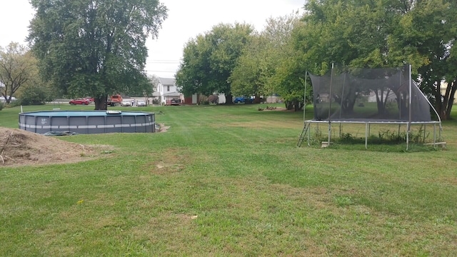 view of yard featuring a trampoline