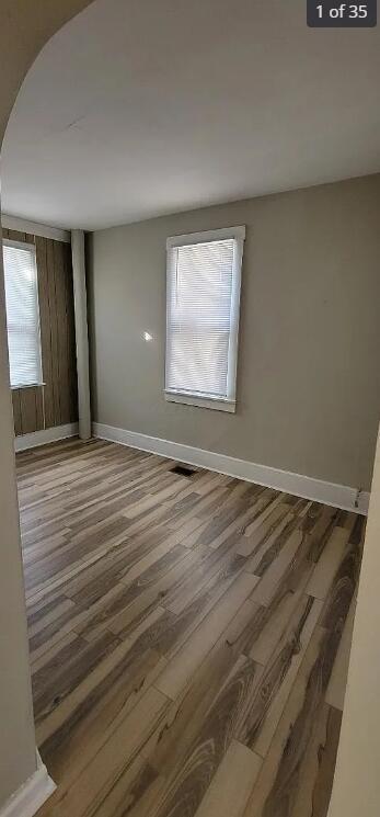 spare room with hardwood / wood-style floors