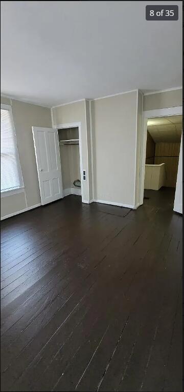 interior space with dark hardwood / wood-style floors