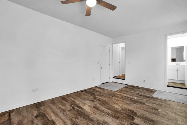 interior space with ceiling fan and dark wood-type flooring