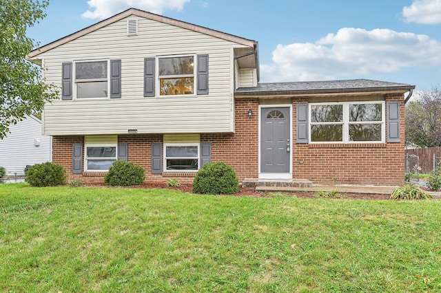 split level home with a front yard