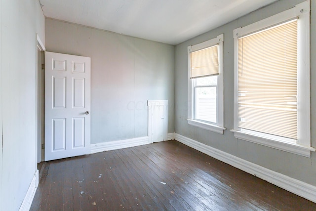 spare room featuring dark hardwood / wood-style floors