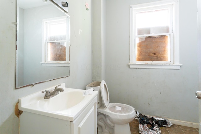 bathroom featuring vanity and toilet