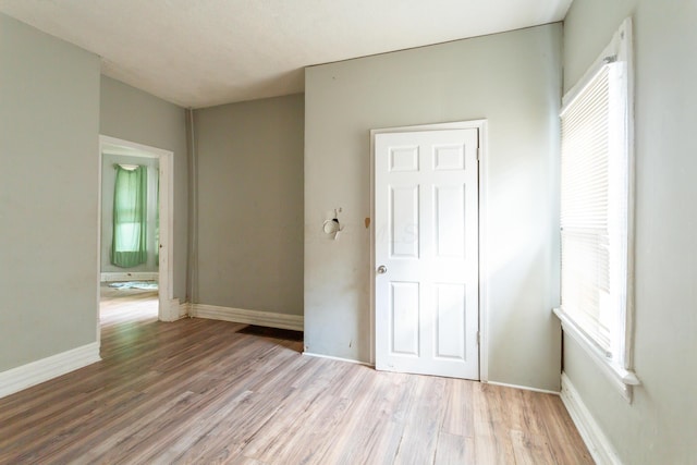 unfurnished bedroom with light hardwood / wood-style floors