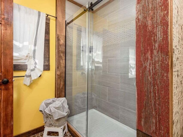 bathroom with tile patterned flooring and an enclosed shower