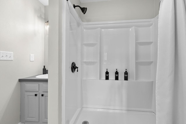 bathroom with vanity and curtained shower