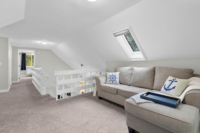 carpeted living room featuring a textured ceiling and vaulted ceiling