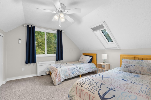 carpeted bedroom featuring a textured ceiling, ceiling fan, and lofted ceiling