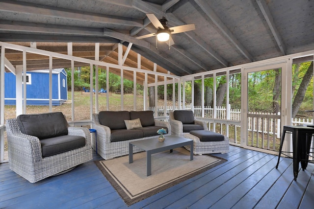 sunroom / solarium with lofted ceiling with beams and ceiling fan