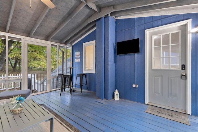 exterior space featuring lofted ceiling with beams and wood ceiling