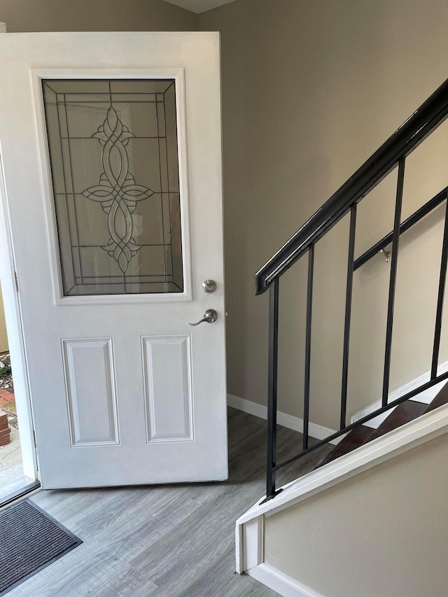 foyer entrance with light hardwood / wood-style floors