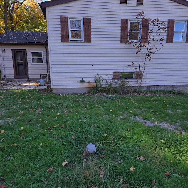 view of side of property with a yard