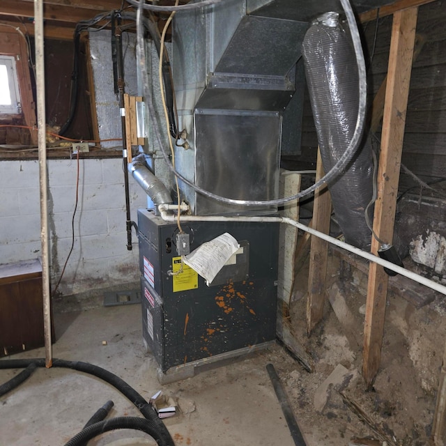 utility room with heating unit