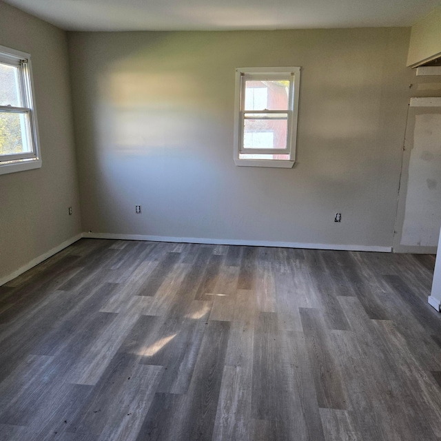 empty room featuring dark hardwood / wood-style flooring