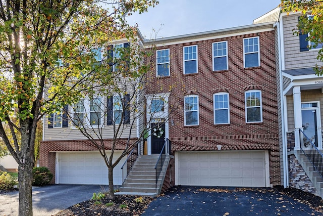 multi unit property featuring a garage