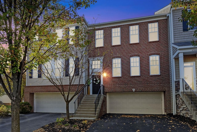 townhome / multi-family property featuring a garage