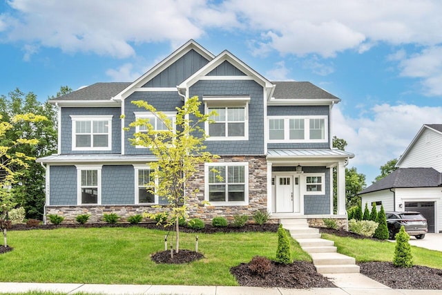 craftsman-style home featuring a front lawn