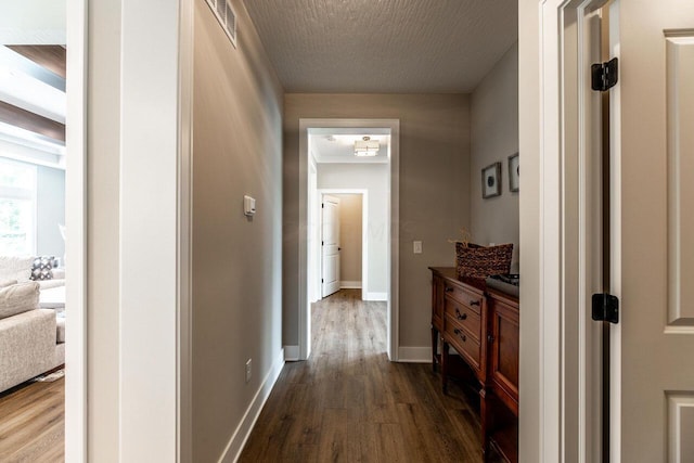 hall featuring dark wood-type flooring