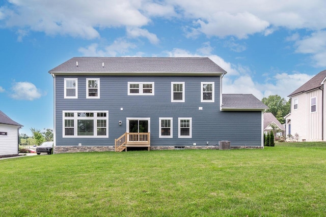 back of property featuring cooling unit and a yard