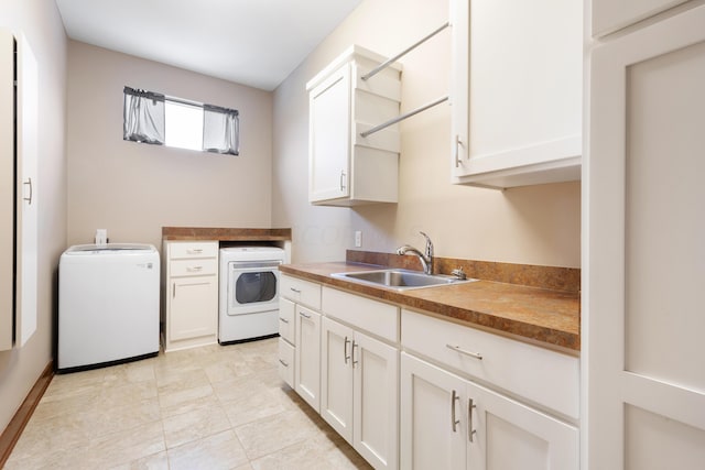 laundry area with light tile patterned floors, sink, and washer / clothes dryer