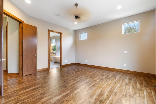 unfurnished room featuring hardwood / wood-style floors