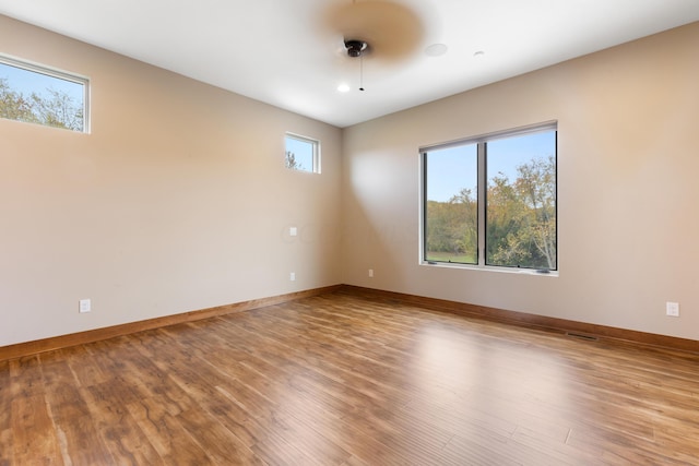 spare room featuring hardwood / wood-style floors