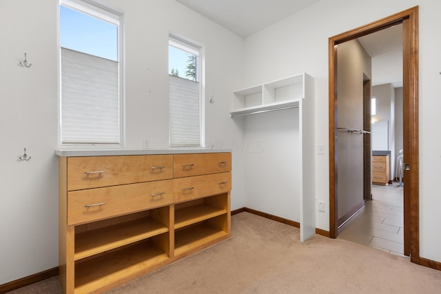 walk in closet featuring carpet