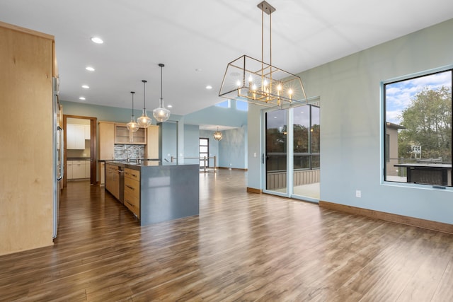 kitchen featuring backsplash, light brown cabinets, a chandelier, dark hardwood / wood-style floors, and hanging light fixtures