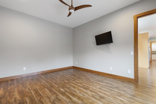 spare room featuring ceiling fan and light hardwood / wood-style floors