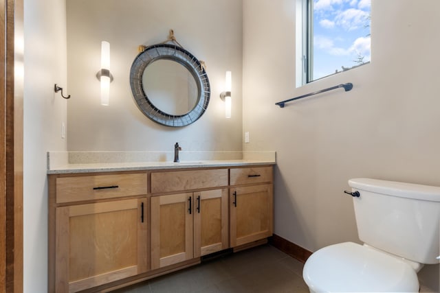 bathroom with tile patterned floors, vanity, and toilet