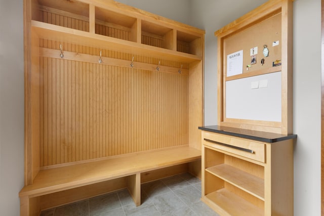 mudroom with light tile patterned floors