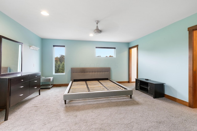 carpeted bedroom with multiple windows