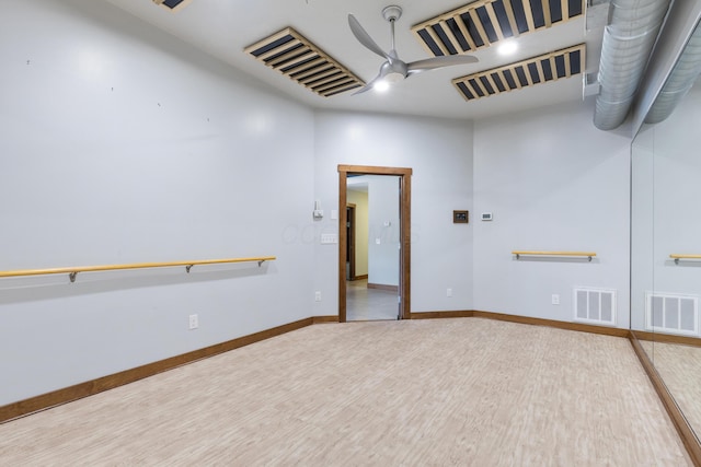 unfurnished room featuring ceiling fan and hardwood / wood-style flooring