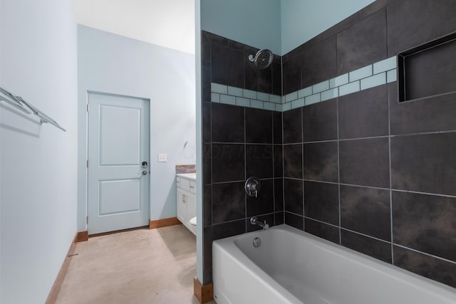 full bathroom with vanity, toilet, and tiled shower / bath