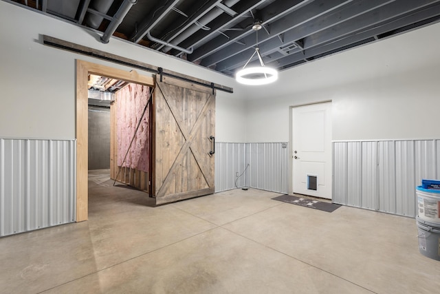 basement featuring a barn door