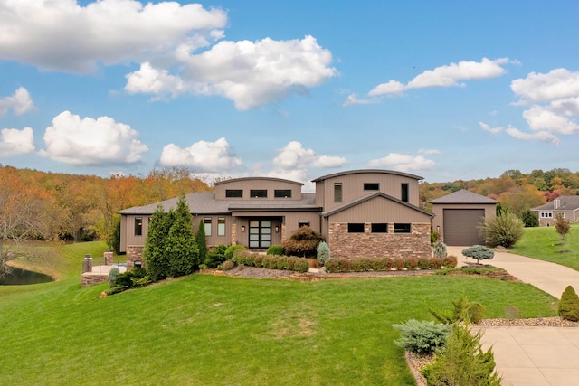 17311 Gambier Rd, Mount Vernon, OH 43050 - view of front facade featuring driveway, stone siding, a front lawn, and a garage