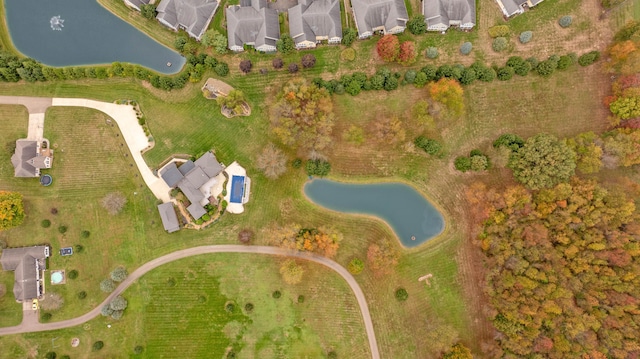 drone / aerial view with a water view