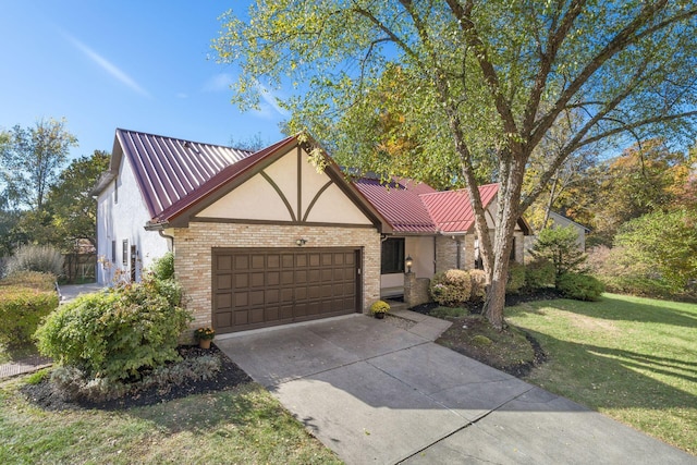 view of front of property with a front lawn and a garage