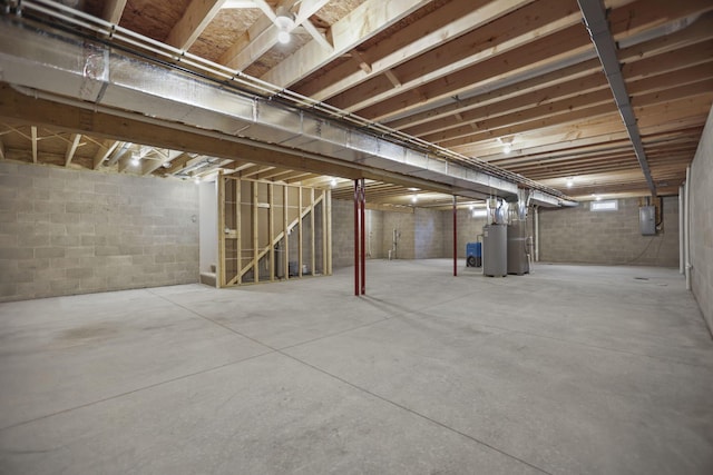 basement with electric panel and gas water heater