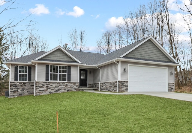 view of front of property with a front yard and a garage