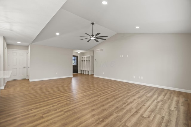 unfurnished living room featuring ceiling fan, light hardwood / wood-style floors, and vaulted ceiling