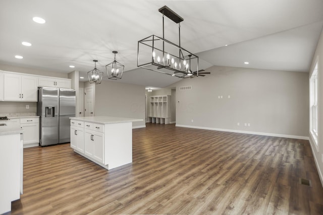 kitchen with ceiling fan, a center island, stainless steel fridge with ice dispenser, pendant lighting, and white cabinets