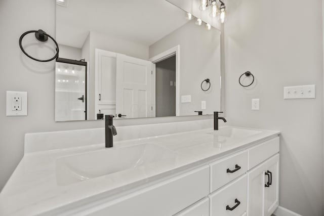 bathroom with a shower with door and vanity