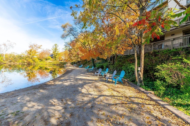 surrounding community featuring a water view