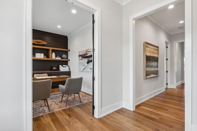 office featuring hardwood / wood-style floors and ornamental molding