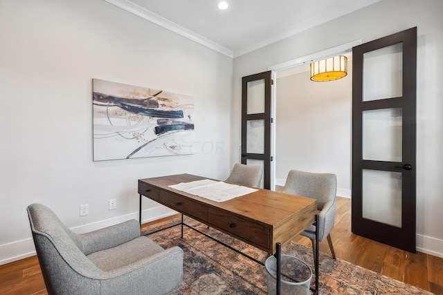 home office featuring wood-type flooring and crown molding