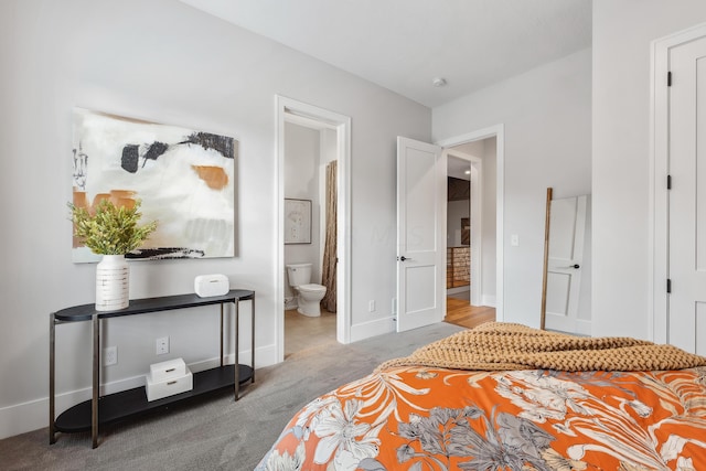 carpeted bedroom with ensuite bath