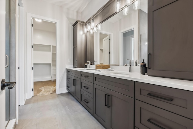 bathroom featuring tile patterned flooring and vanity