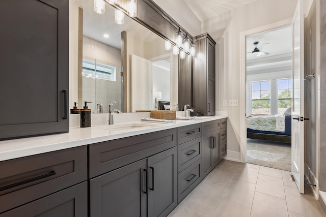 bathroom with ceiling fan, tile patterned flooring, vanity, and an enclosed shower