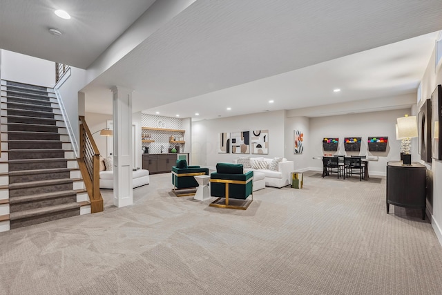 living room with light colored carpet and bar